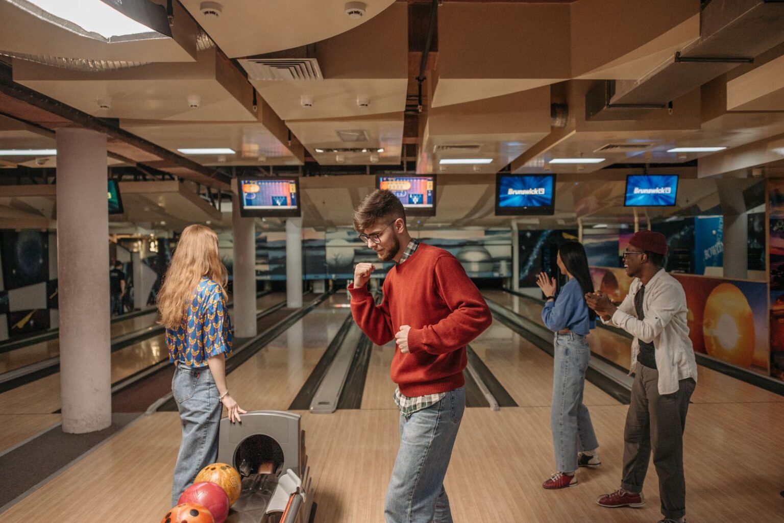 Group celebrating while bowling