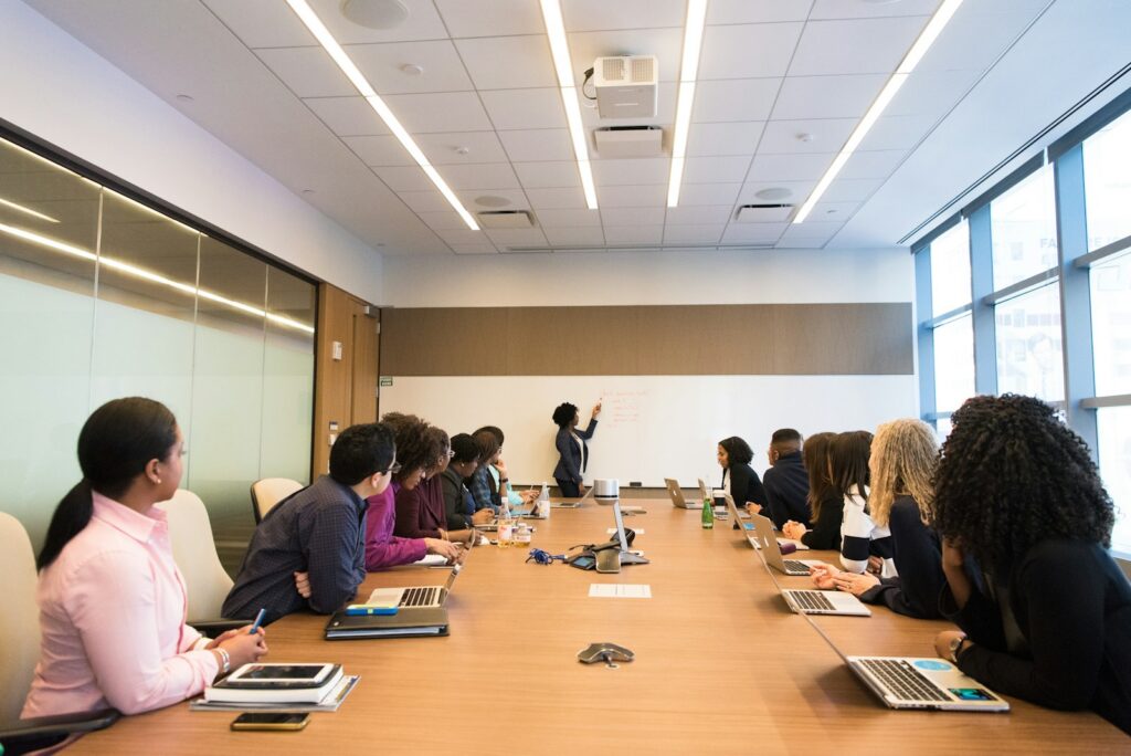 Team seated around a long boardroom table during a meeting
